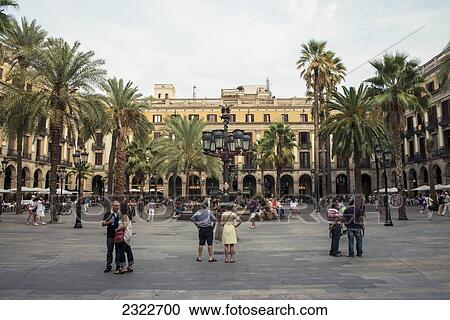 Stock Image - Spain, Tourist on Placa Reial; Barcelona. Fotosearch