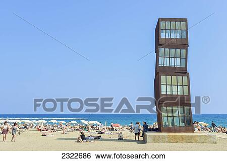 Stock Photograph - Spain, View of beach with people sunbathing; Barcelona. Fotosearch