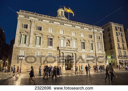 Stock Photograph - Spain, View of city square at dusk; Barcelona. Fotosearch