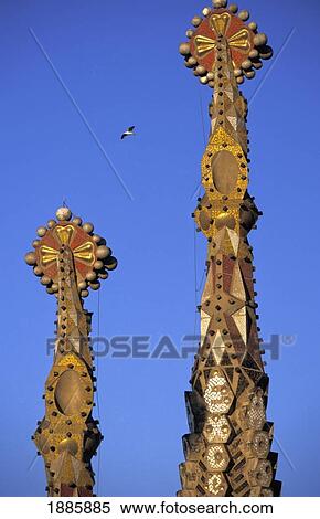 Stock Photography - Spires Of Sagrada Familia With Bird Flying By. Fotosearch