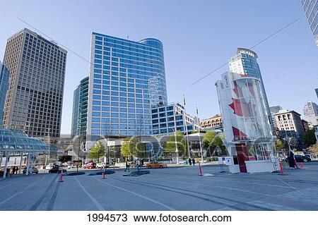 Stock Image - Square Between Canada Place And The Vancouver Convention Centre, Vancouver, British Columbia, Canada. Fotosearch