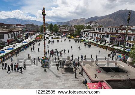 Stock Photography - Square in front of Jokhang Temple, with Potala Palace in the distance; Lhasa, Tibet, China. Fotosearch