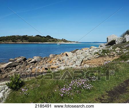 Stock Image - St Agnes Viewed From The Island Of Gugh Showing The Sand Bar (Tombolo), Isles Of Scilly, Cornwall, United Kingdom, Europe. Fotosearch