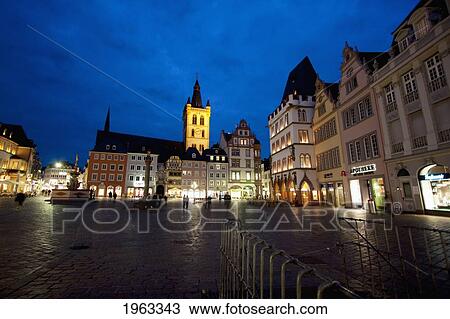 Stock Image - St. Gangolf Church And Hauptmarkt (Main Market) Square At Night, Trier, Rhineland-Palatinate, Germany. Fotosearch