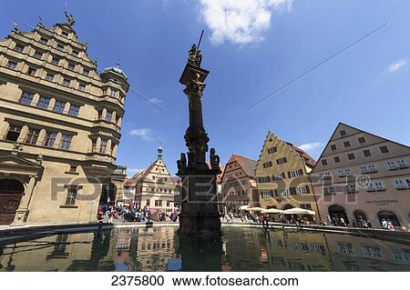 Stock Image - St. George and the Dragon fountain on the Marktplatz, Rothenburg-ob-der-Tauber, Bavaria, Germany. Fotosearch