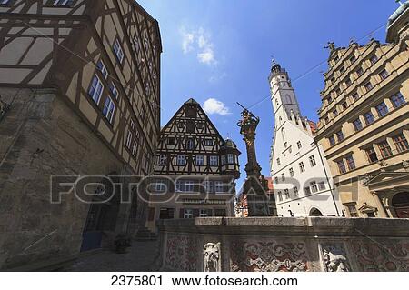 Stock Image - St. George and the Dragon fountain on the Marktplatz, Rothenburg-ob-der-Tauber, Bavaria, Germany. Fotosearch