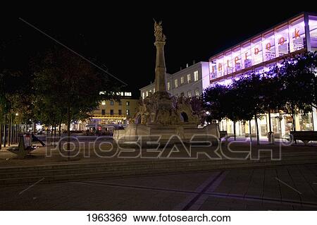 Stock Photo - St. George's Fountain On The Kornmarkt At Night, Trier, Rhineland-Palatinate, Germany. Fotosearch