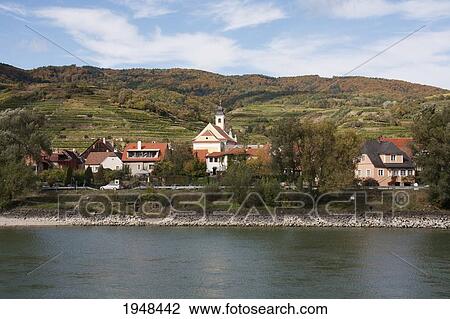 Stock Image - St. Lorenz, as seen from the Danube River in Wachau, Lower Austria, Austria. Fotosearch