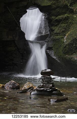 Stock Photography - St Nectan's Kieve, waterfall through a hole in the rocks; Tintagel, Cornwall, England. Fotosearch