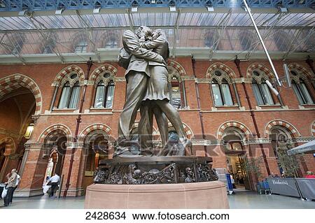 St. Pancras Railway Station and statue of kissing couple; London, England View Large Photo Image Picture - St. Pancras Railway Station and statue of kissing couple; London, England. Fotosearch