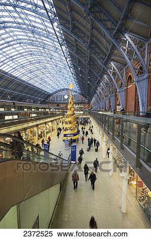 Stock Photography - St Pancras station with an indoor Christmas tree; London, England. Fotosearch