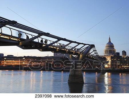Stock Photo - St Paul's Cathedral and the Millennium Bridge, River Thames; London, England. Fotosearch