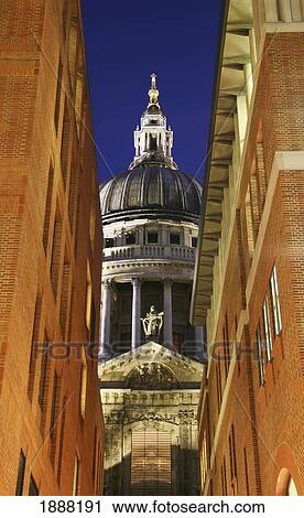 Stock Image - St Paul's Cathedral Dome Seen Through Two Buildings. Fotosearch