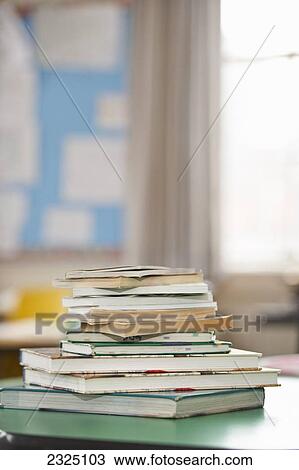 Stock Image - Stack Of Schoolbooks In A Classroom, Toronto, Ontario, Canada. Fotosearch