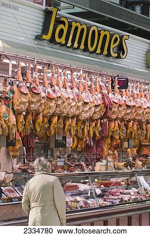Stock Image - Stall In Mercado Central Selling Ham; Valencia, Spain. Fotosearch