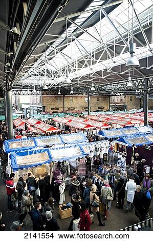 Stalls Inside Spitalfields Market In East London, London, Uk View Large Photo Image Picture - Stalls Inside Spitalfields Market In East London, London, Uk. Fotosearch