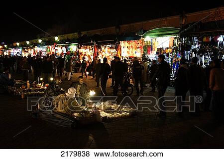 Stock Photo - Stalls lit up a night in the Djemaa el Fna; Marrakesh, Morocco. Fotosearch