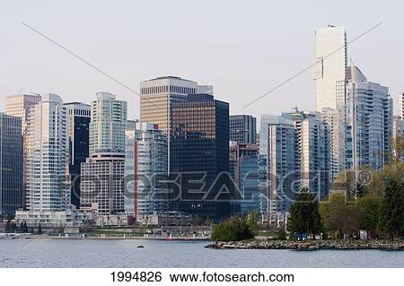 Stanley Park And Downtown Buildings Overlooking Coal Harbor At Dawn, Vancouver, British Columbia, Canada View Large Photo Image Stock Photograph - Stanley Park And Downtown Buildings Overlooking Coal Harbor At Dawn, Vancouver, British Columbia, Canada. Fotosearch