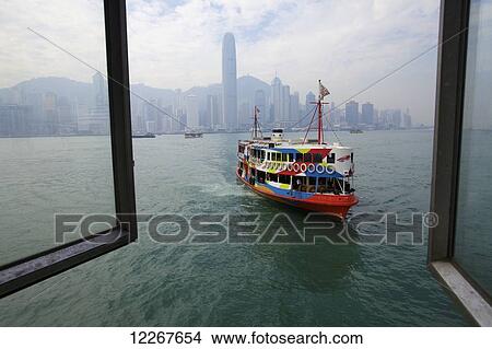 Star Ferry arriving at Tsim Sha Tsui terminal; Hong Kong View Large Photo Image Picture - Star Ferry arriving at Tsim Sha Tsui terminal; Hong Kong. Fotosearch