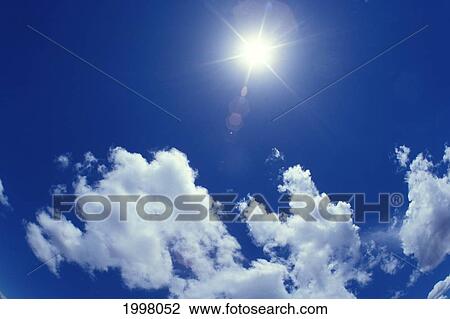Star Filter Sun And Clouds In Blue Skies View Large Photo Image Stock Image - Star Filter Sun And Clouds In Blue Skies. Fotosearch
