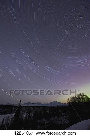 Stock Photo - Star trails over Mt. McKinley; Alaska, United States of America. Fotosearch