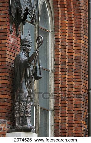Stock Photograph - Statue Of A Bishop By The Cross Gallery, Riga, Latvia. Fotosearch