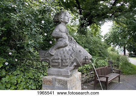 Statue Of A Boy On A Fish Fountain, Worms, Germany View Large Photo Image Stock Image - Statue Of A Boy On A Fish Fountain, Worms, Germany. Fotosearch
