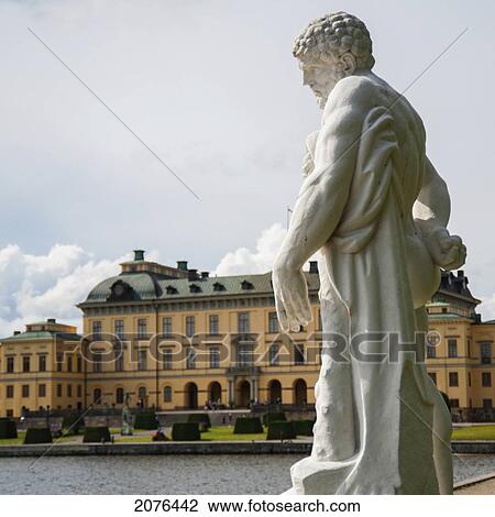 Statue Of A Male Figure And Drottningholm Palace; Stockholm Sweden View Large Photo Image Stock Image - Statue Of A Male Figure And Drottningholm Palace; Stockholm Sweden. Fotosearch
