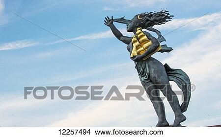 Picture - Statue of a woman holding a gold sailing vessel; South Shields, Tyne and Wear, England. Fotosearch