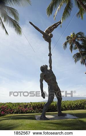 Statue Of Acrobats; Maui, Hawaii, Usa View Large Photo Image Stock Photo - Statue Of Acrobats; Maui, Hawaii, Usa. Fotosearch