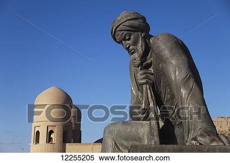 Stock Photography - Statue of Al Khwarezmi (Al Khwarizmi) and West Gate, outside Ichan Kala Old City, Kizilkum desert; Khiva, Khwarezm region, Uzbekistan. Fotosearch