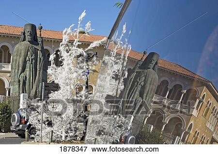 Stock Photo - Statue Of Archbishop Makarios And White Tree Reflected In Bus. Fotosearch