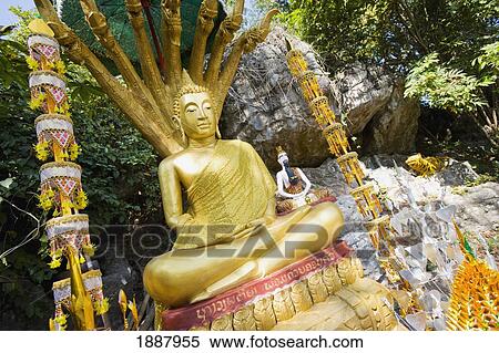 Stock Photography - Statue Of Buddha On Phu Si Hill.. Fotosearch