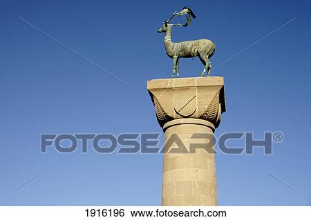 Stock Photograph - Statue Of Deer At Entrance To Harbour. Fotosearch