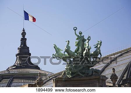 Statue Of Horses And A Lady On Top Of A Pillar With A Dome Tower And A French Flag At The Grand Palais; Paris, France View Large Photo Image Stock Photo - Statue Of Horses And A Lady On Top Of A Pillar With A Dome Tower And A French Flag At The Grand Palais; Paris, France. Fotosearch