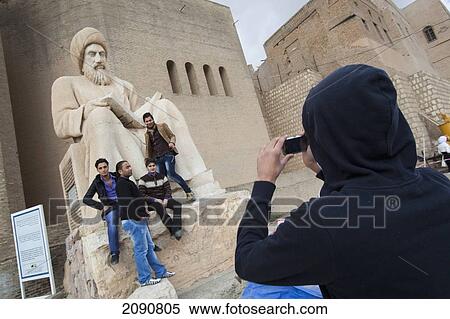 Statue Of Ibn Al-Mistawfi Which Guards The Entrance To The Erbil Citadel, Erbil, Iraqi Kurdistan, Iraq View Large Photo Image Stock Photography - Statue Of Ibn Al-Mistawfi Which Guards The Entrance To The Erbil Citadel, Erbil, Iraqi Kurdistan, Iraq. Fotosearch