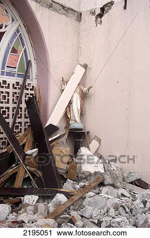 Stock Image - Statue Of Jesus Behind Roof Beam In The Ruins Of The Catholic Cathedral After Being Hit By Hurricane Ivan, St Georges, Grenada.. Fotosearch