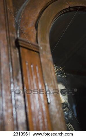 Stock Image - Statue of Jesus Christ inside wooden cabinet; Guanajuato, Guanajuato, Mexico. Fotosearch