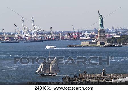Stock Photography - Statue of Liberty, as seen from the Brooklyn Bridge, New York City, New York, United States. Fotosearch