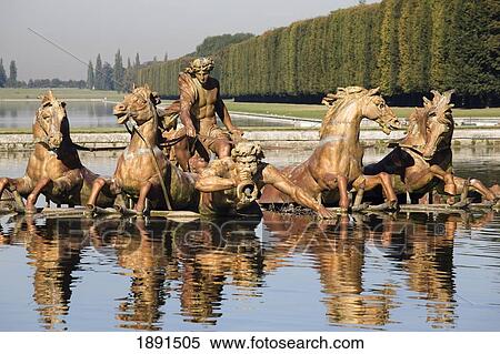 Stock Photography - Statue Of Men And Horses Reflected In A Pool; Paris, France. Fotosearch