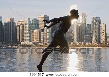Statue Of Olympic Runner, Harry Jerome In Stanley Park At Sunrise, Vancouver, British Columbia, Canada View Large Photo Image Stock Photo - Statue Of Olympic Runner, Harry Jerome In Stanley Park At Sunrise, Vancouver, British Columbia, Canada. Fotosearch