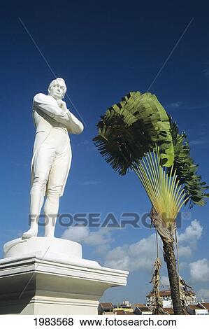 Stock Photo - Statue of Sir Stamford Raffles near Singapore river and Boat Quay; Singapore. Fotosearch