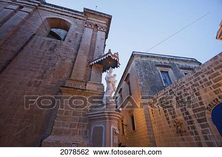 Statue Of The Virgin And Child On A Corner Of The Carmelite Church At Night, Mdina, Malta View Large Photo Image Stock Image - Statue Of The Virgin And Child On A Corner Of The Carmelite Church At Night, Mdina, Malta. Fotosearch