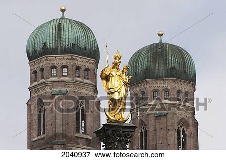 Statue Of The Virgin Mary At The Marienplatz With The Frauenkirche In The Background, Munich, Bavaria, Germany View Large Photo Image Stock Photo - Statue Of The Virgin Mary At The Marienplatz With The Frauenkirche In The Background, Munich, Bavaria, Germany. Fotosearch