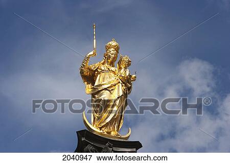 Stock Photo - Statue Of The Virgin Mary At The Marienplatz, Munich, Bavaria, Germany. Fotosearch