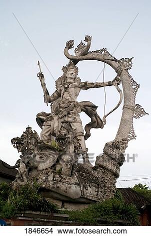 Statue Of Woman With Bow; Bali, Indonesia View Large Photo Image Picture - Statue Of Woman With Bow; Bali, Indonesia. Fotosearch