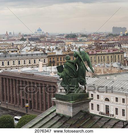 Statue On A Rooftop With Saint Isaac's Cathedral And Saint Isaac's Square In The Distance; St. Petersburg Russia View Large Photo Image Stock Photo - Statue On A Rooftop With Saint Isaac's Cathedral And Saint Isaac's Square In The Distance; St. Petersburg Russia. Fotosearch
