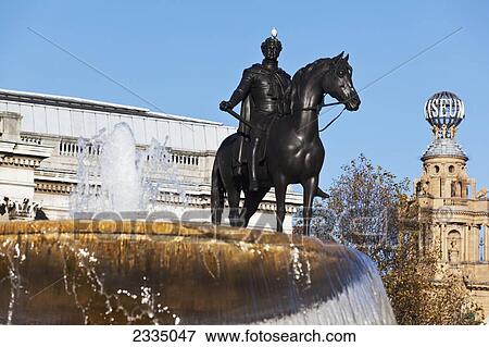 Stock Photo - Statue Standing In Fountain, Trafalgar Square; London, England, Uk. Fotosearch