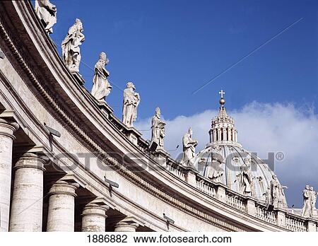 Stock Image - Statues Above Columned Entrance Area To Piazza San Pietro With St Peter's Basilica Behind, Vatican City. Fotosearch