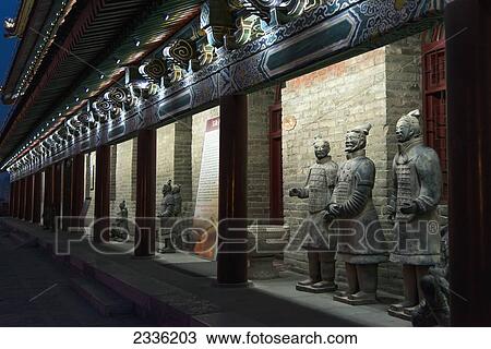 Statues Along The Illuminated Wall Of A Building At Night Along The Lianhu Ancient City Wall; Xi'an, Shaanxi, China View Large Photo Image Stock Image - Statues Along The Illuminated Wall Of A Building At Night Along The Lianhu Ancient City Wall; Xi'an, Shaanxi, China. Fotosearch